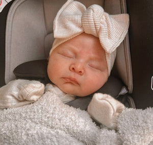 baby girl in Headwrap bow stretchy and adjustable ivory ribbed neutral girl
