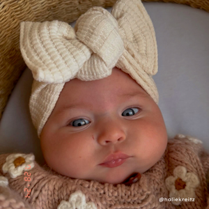 baby girl in chunky waffle fabric knit tie on headwrap bow baby