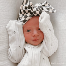 black wavy checker bow on baby girl
