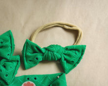 green eyelet nylon headband bow of newborn baby girl