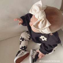 baby girl in Headwrap bow stretchy and adjustable ivory ribbed neutral girl