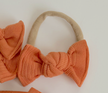 light orange ribbed nylon headband bow for baby girl