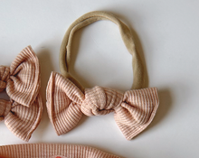 peach mini ribbed nylon headband for baby girl newborn bow