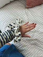 polka dot scrunchie on wrist